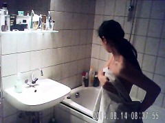 Asian gal with long hair gets undressed and bathes on hidde