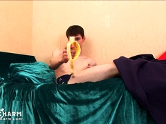 Wanking boy eats a banana dreaming about oral job