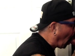 Greedy gloryhole DILF with tattoos sucks cock at home